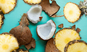 Coconut chunks and pineapple slices scattered