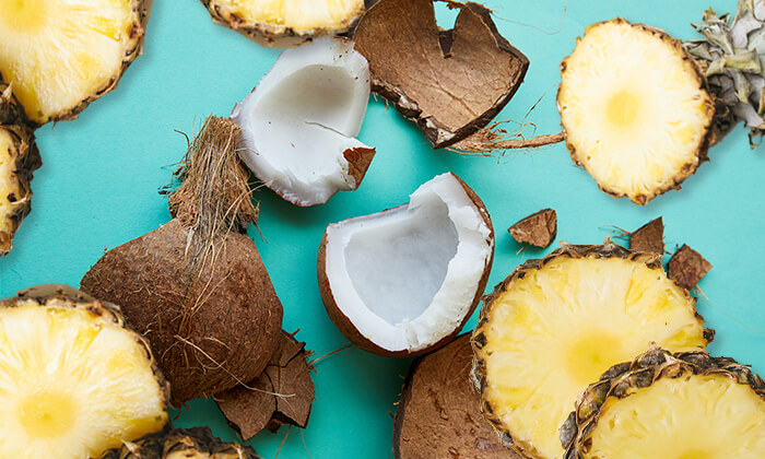 pina-colada-popsicle Coconut chunks and pineapple slices scattered