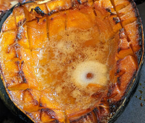 Acorn squash roasted with brown sugar and vegan butter