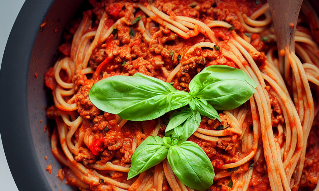 Vegan bolognese with spaghetti and fresh basil